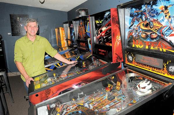 Steve Long, who opened Tilt! Pinball arcade in Louisville last month, says: "For years, I've collected pinball machines from all eras. Pinball was really my reason for starting this." (Doug Pike / Colorado Hometown Weekly)